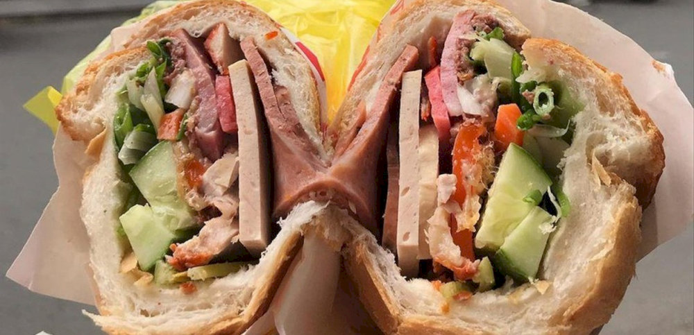 Banh mi 59 is known for its unique blend of meats, including cold cuts, grilled pork, and pâté 